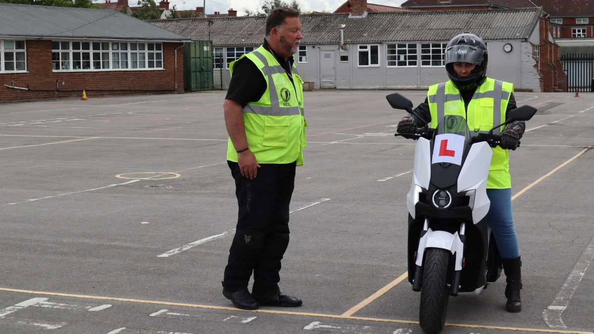 a new rider taking their CBT on an electric motorcycle